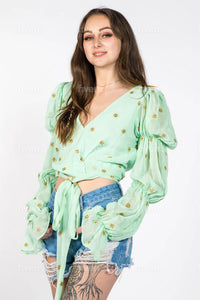 Minty green floral top with romantic sheer sleeves and front tied waist